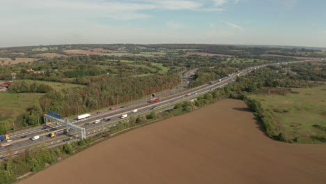 aerial shot over m25 motorway interchange