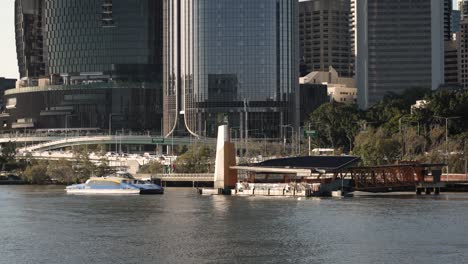 View-of-CityCat-arriving-at-QUT-Ferry-Stop-in-Brisbane-City-in-the-afternoon-light,-Queensland,-Australia