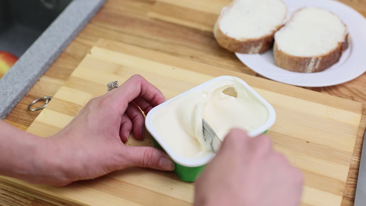 Spreading Cream Cheese on Bread
