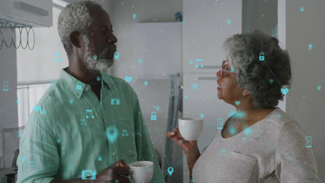Animazione di una rete di connessioni con icone sovrapposte a una coppia anziana afroamericana che parla