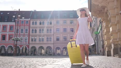a joyful young tourist girl walks through the scenic streets of a european city. high quality fullhd footage