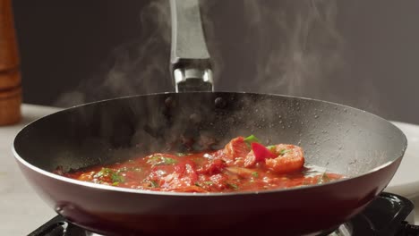 cooking red sauce in a pan