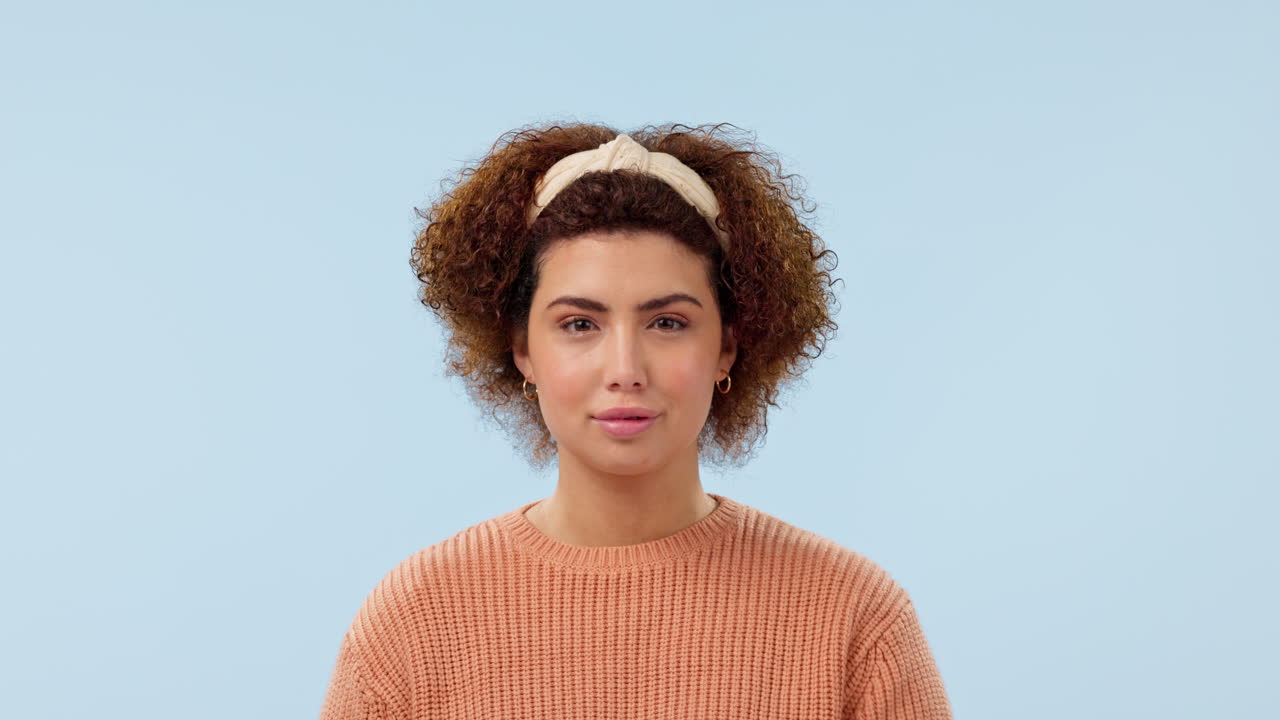 Woman with finger to lips, secret