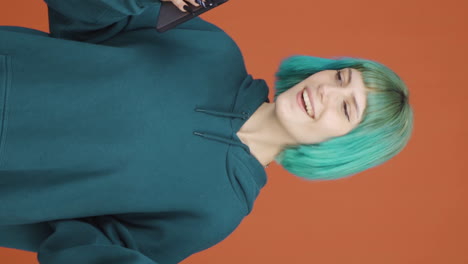 vertical video of the young woman who likes the new app. phone app.