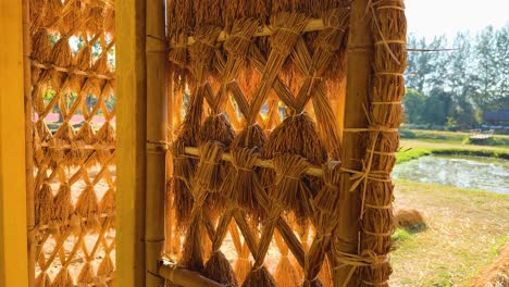 bamboo and straw structure near rice fields