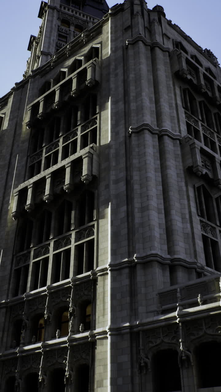 Historic building stands tall under a cloudy sky in an urban setting