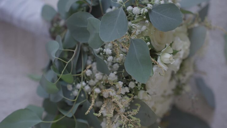 Detailed view of white wedding bouquet with eucalyptus greenery