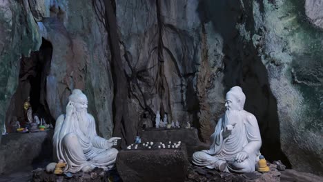 buddha statue at marble mountains, da nang, vietnam, asia - pan up shot