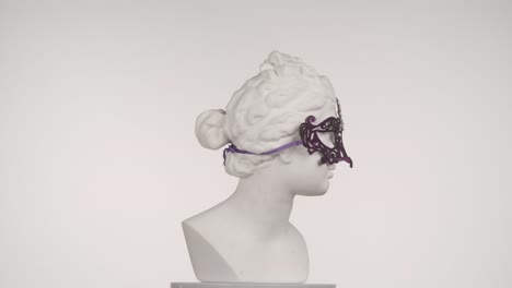 antique bust with a purple mask
