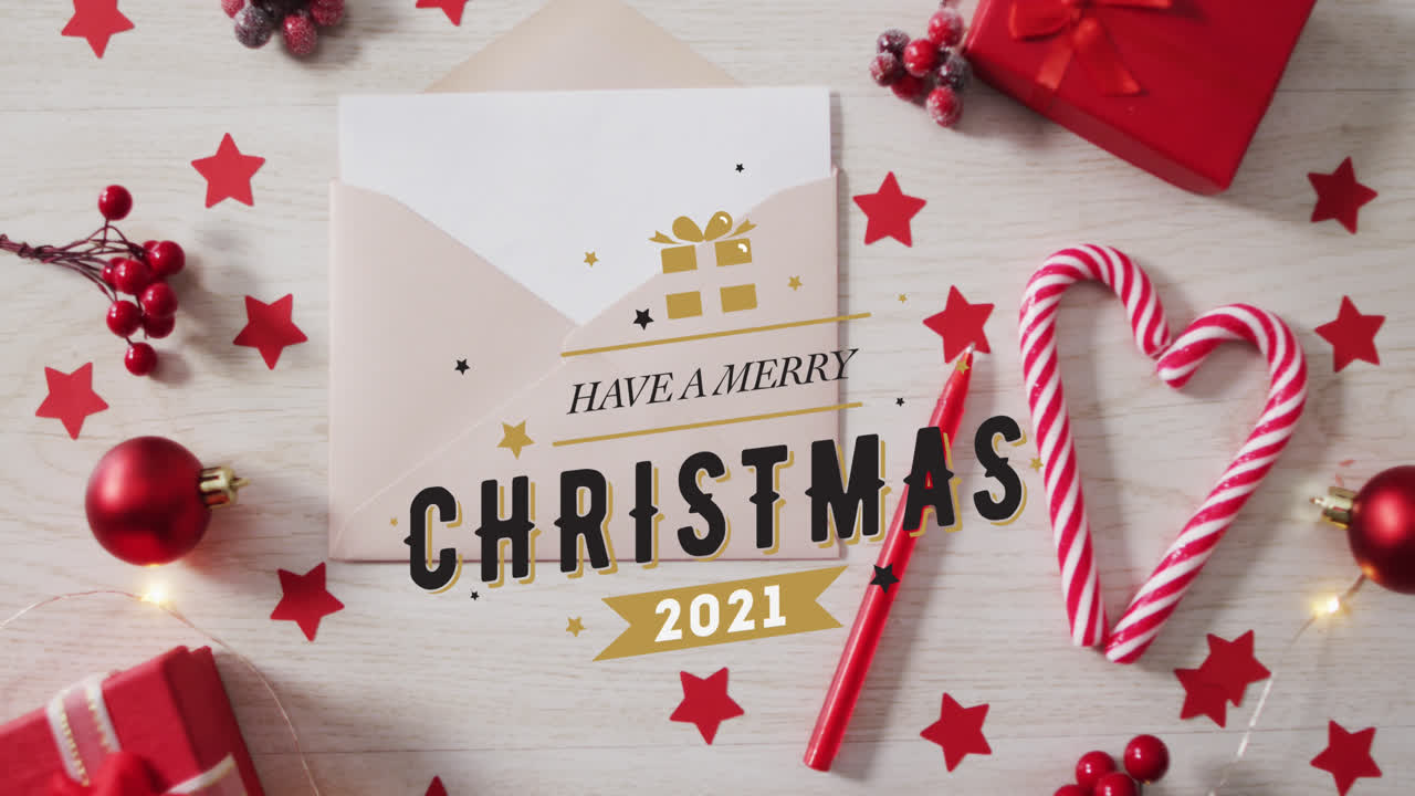 animación del texto de feliz navidad sobre las decoraciones navideñas