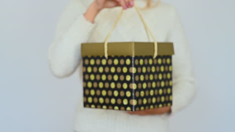 Woman Shows A Gift Box With Lid And Handles