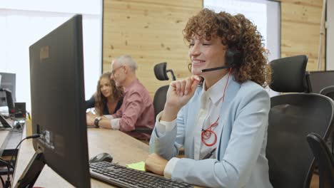 customer service representatives at work in a modern office