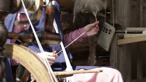 young female spinning yarn