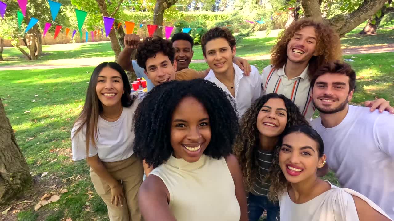 Diverse group of friends celebrating together in a park