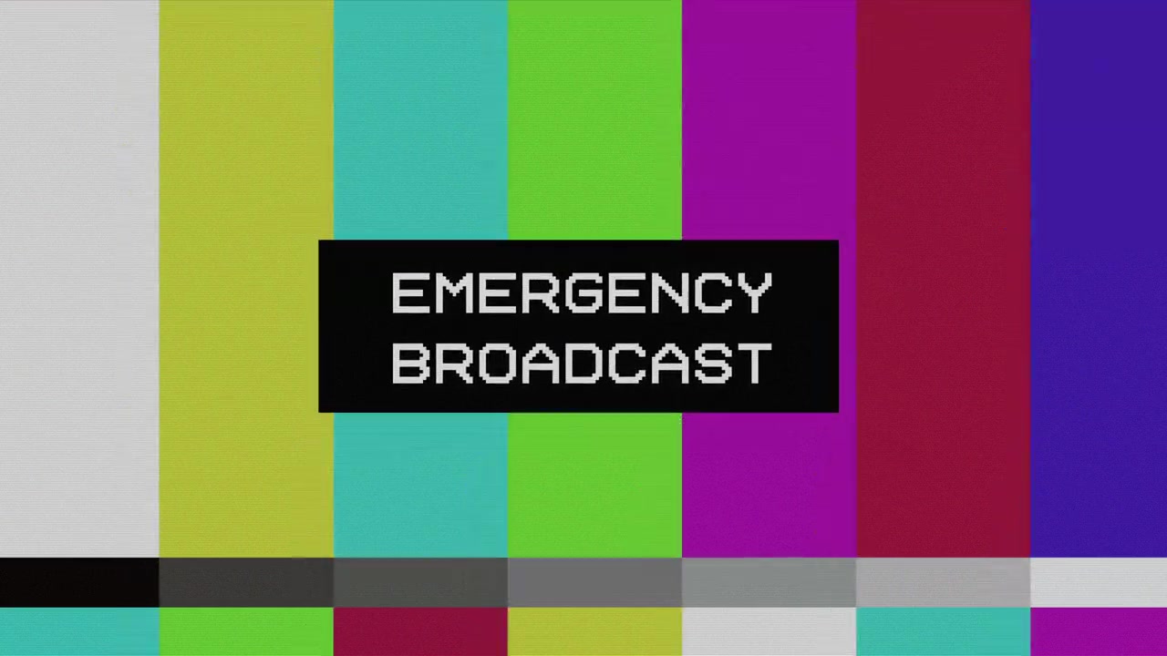 Nødudsendelsesbesked på TV-testbillede med glitch-effekt