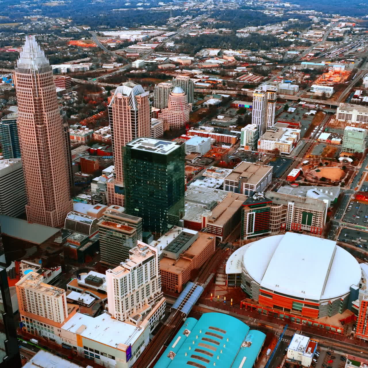 Group of skyscrapers standing out in the low-rise architecture of the American cityscape. Charlotte, North Carolina, USA top view.