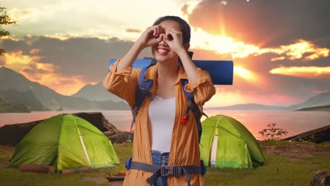 woman hiking in beautiful landscape camping site at sunset