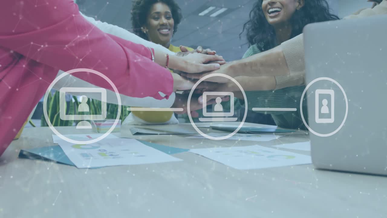 Animation of icons and data processing over diverse business people stacking hands in office
