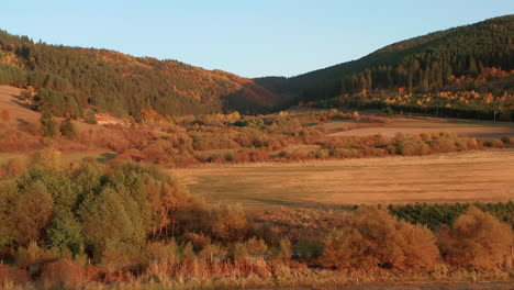 Aerial-view-of-valley,-foothills-in-beautiful-autumn-color