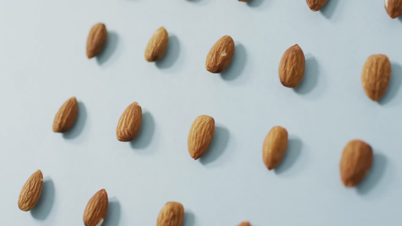 Video of almonds on blue background