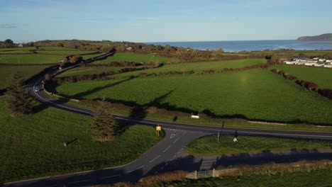 aerial view orbiting vehicles restriction to 20 miles per hour speed limit in rural farming countryside