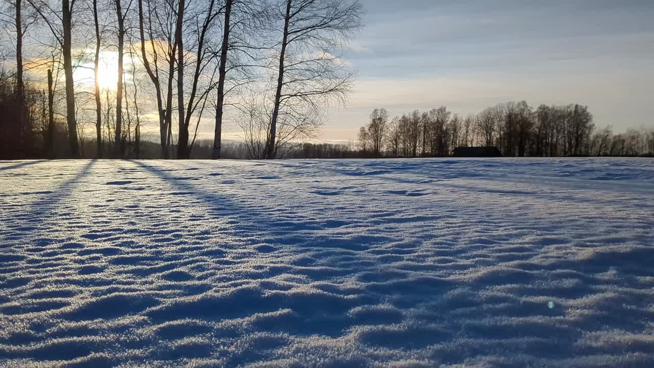Calm winter landscape, snowy field scenery at sunset