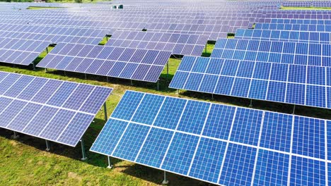 aerial view of a huge electricity farm. solar panels on the field in the rows at sunlight. photovoltaic panel system. alternative source of energy.