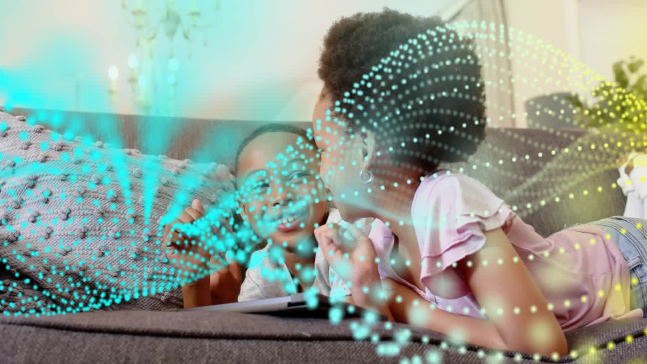 Girl tapping tablet while boy pointing on couch, animated dot wave revealing learning content