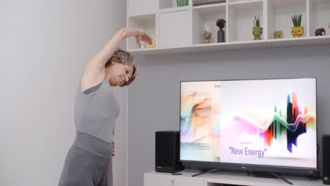 Senior Woman Doing Online Exercise at Home