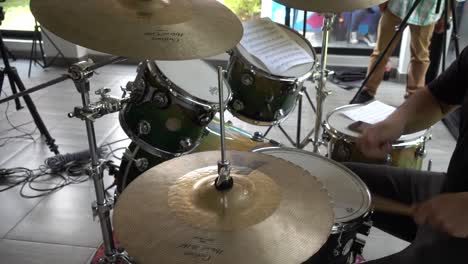 drummer playing drums in a studio