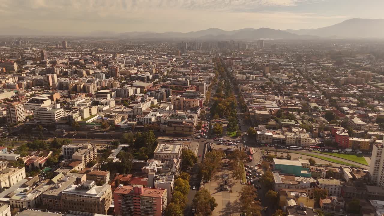 A dynamic aerial view of , Chile, captured by drone as it glides smoothly over the vibrant cityscape.