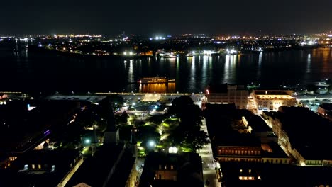 Droning-towards-the-Mississippi-River-as-a-dinner-cruise-paddle-boat-cruises-by