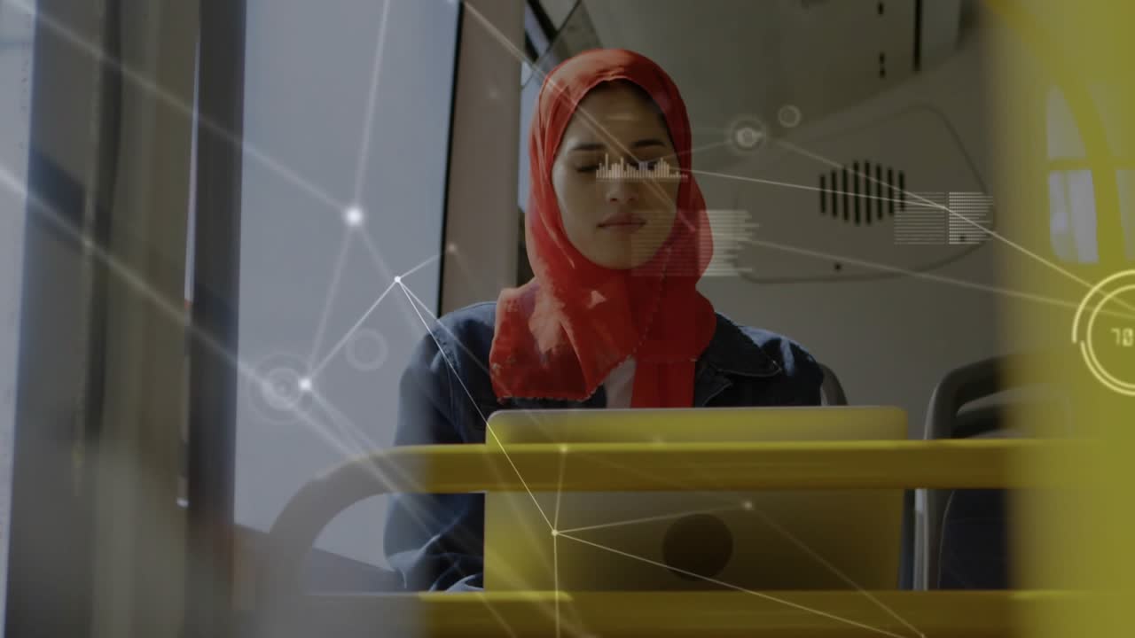 Woman tapping tablet on yellow tray, rider glancing out while tech network overlay mapping data