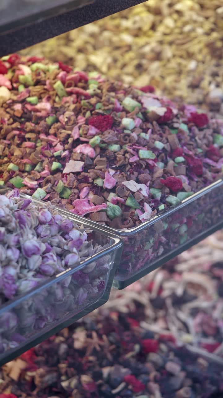 Assortment of Colorful Dried Herbs and Teas on Display