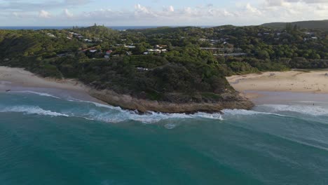 cylinder beach - ocean waves crashing on cylinder headland foreshore - point lookout, qld, australia