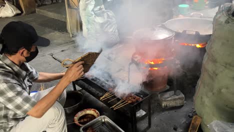 chicken satay is a typical indonesian food, soft chicken meat is cut into cubes then skewered and grilled over charcoal.
