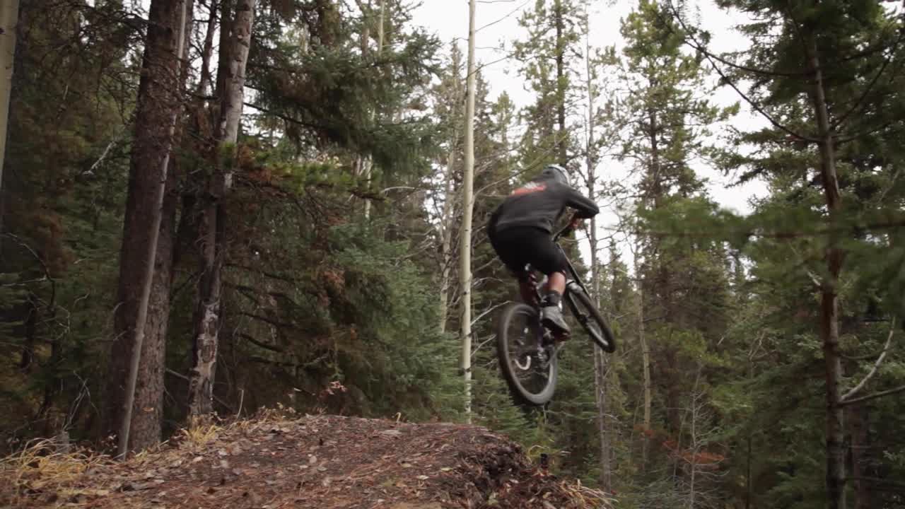Bikers jumps away on a big jump