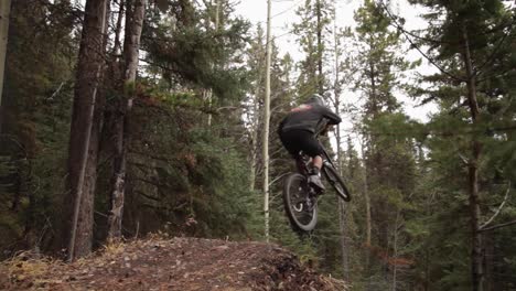 bikers jumps away on a big jump