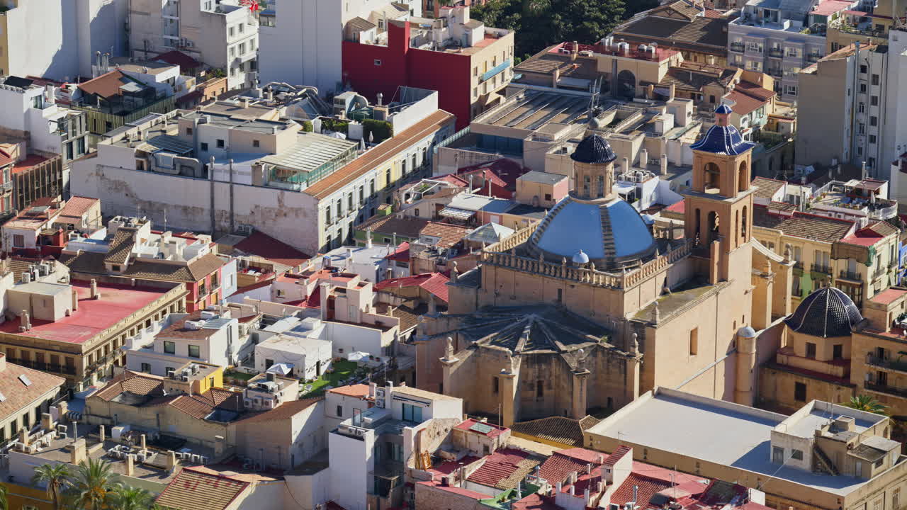The blue-tiled dome and bell tower of Concatedral de San Nicolas de Bari rising above the old town's rooftops