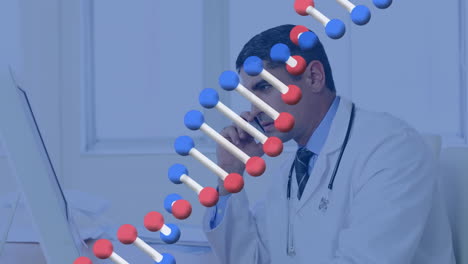 animación de una cadena de adn sobre un médico masculino biracial hablando por teléfono