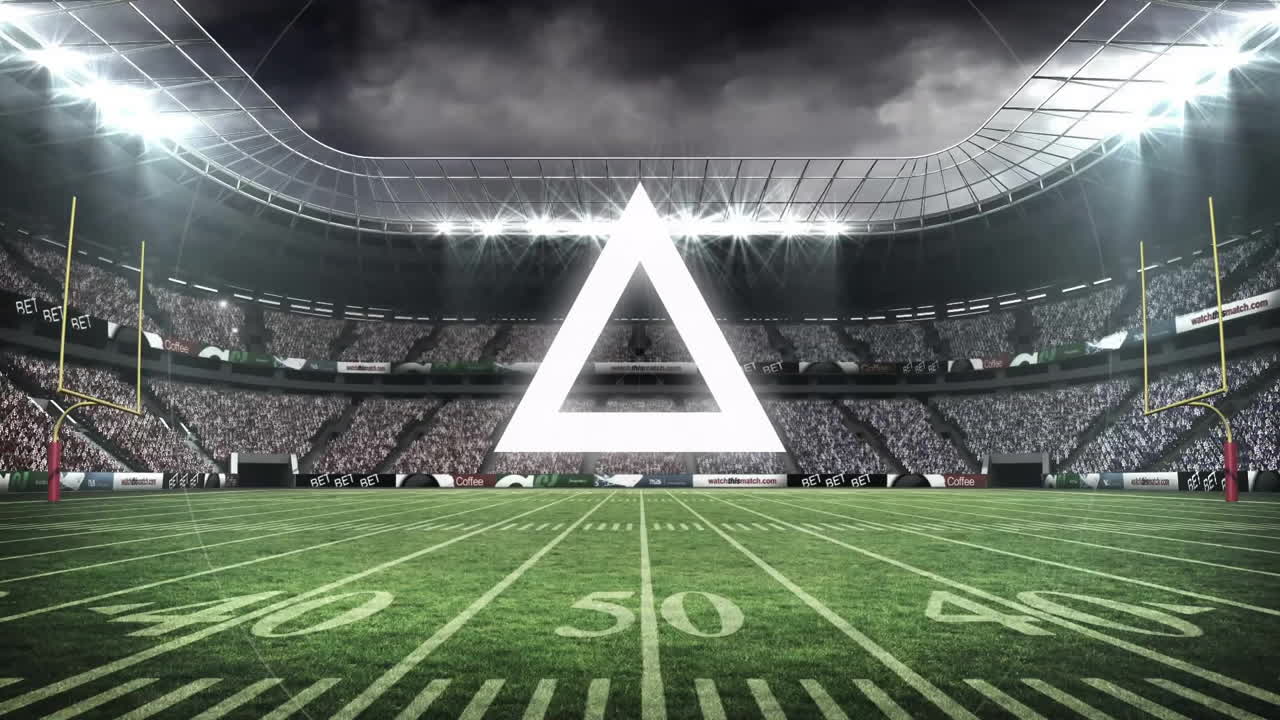 Glowing triangle animation hovering above football stadium under dramatic sky