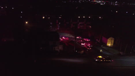 night aerial shot of ambulance and police cars