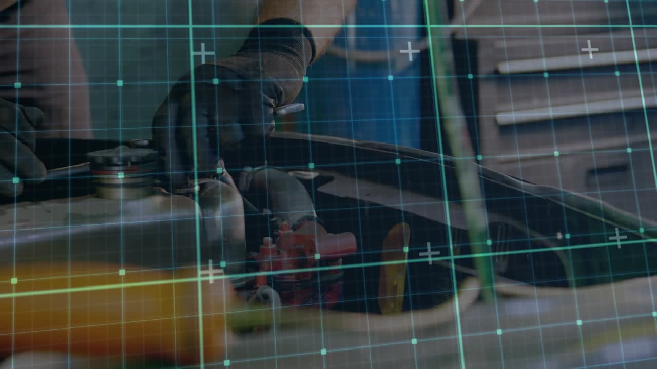 Animation of grid pattern over caucasian male mechanic repairing vehicle in garage