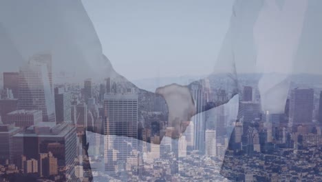 animation of businessman handshake over cityscape