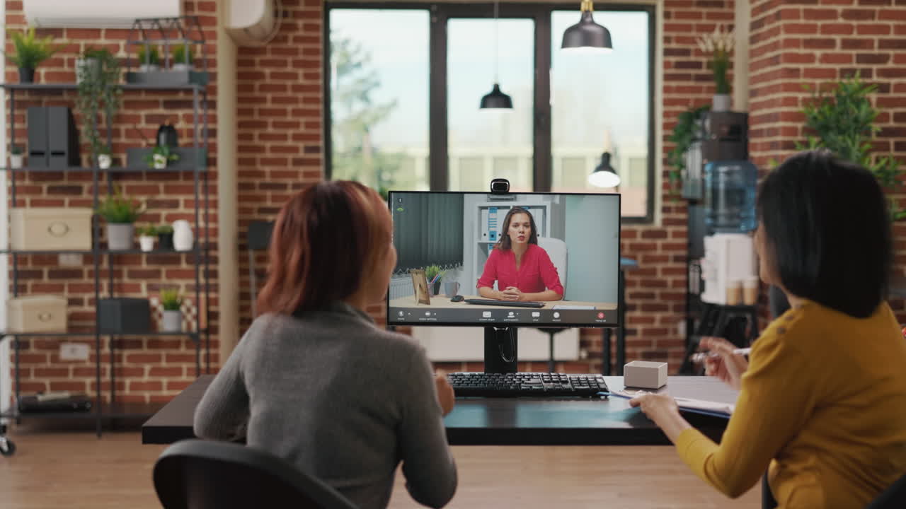 Business women meeting with candidate on online video call