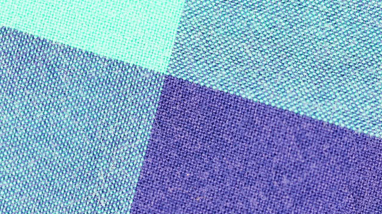 Square Pattern With Different Shades Of Blue On Textured Fabric