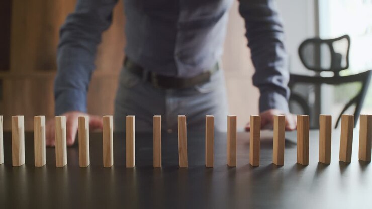 Concept For Domino Effect And Chain Reaction In Business