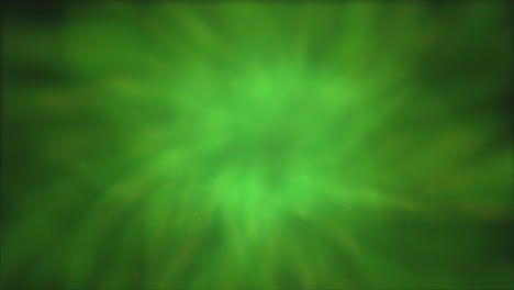 glimmering green spiral mesmerizing blurred pattern with a center of radiance