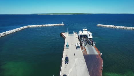 Cars-and-trucks-deboard-the-Washington-Island-Car-Ferry-at-Northport,-Wisconsin-located-on-the-far-north-shore-of-the-Door-County-Peninsula