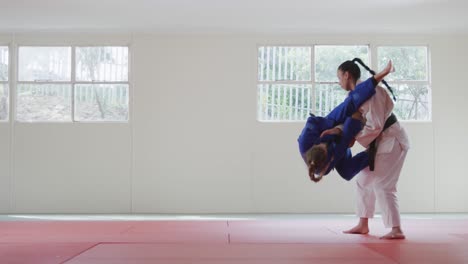 judokas fighting and immobilizing on the ground